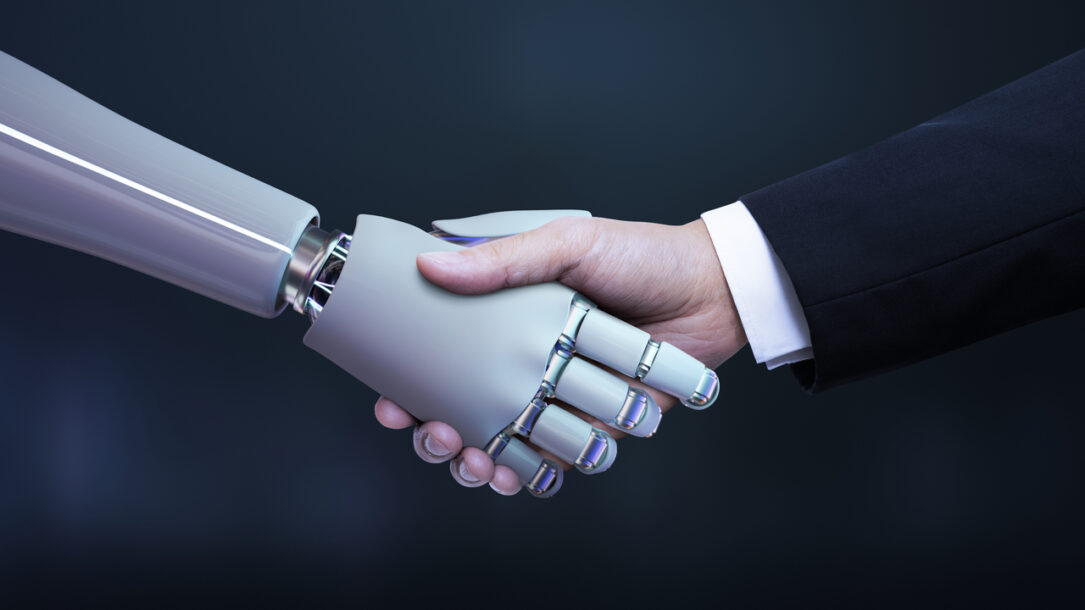 grafika uścisk dłoni ludzkiej i robota